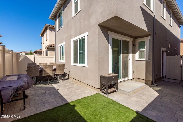 rear view of house featuring a patio area