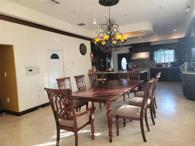 dining area with a notable chandelier