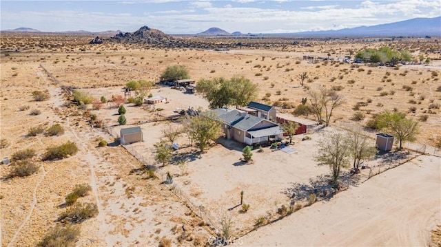 birds eye view of property with a mountain view