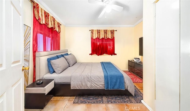 bedroom with ceiling fan, crown molding, and wood-type flooring