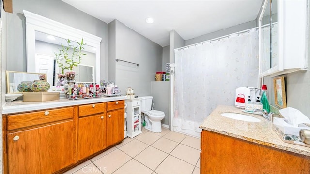 bathroom featuring tile patterned floors, vanity, toilet, and a shower with curtain