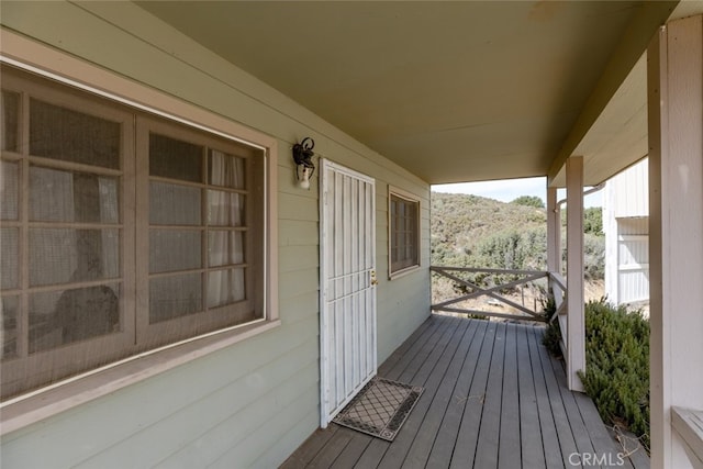 wooden deck featuring covered porch