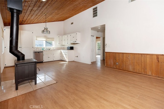 kitchen featuring dishwasher, wooden ceiling, high vaulted ceiling, hanging light fixtures, and white cabinetry