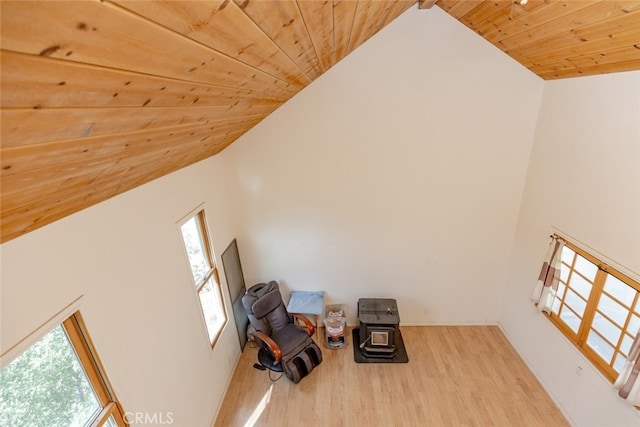 unfurnished room featuring a wealth of natural light, hardwood / wood-style floors, and wood ceiling