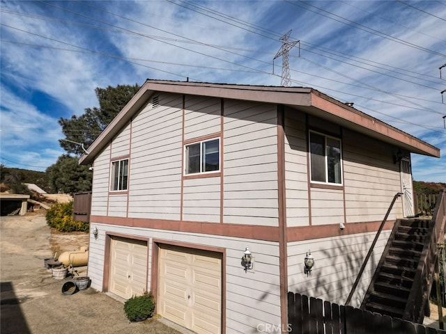 view of home's exterior with a garage