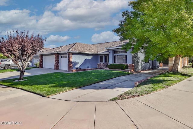 view of front of home with a garage and a front yard