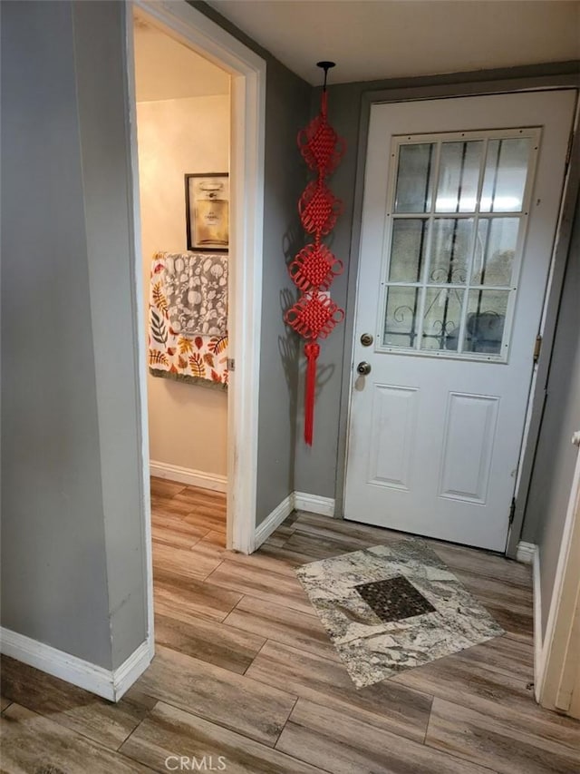 entryway with light hardwood / wood-style floors