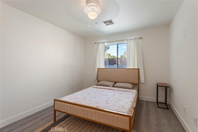 bedroom featuring ceiling fan and hardwood / wood-style flooring