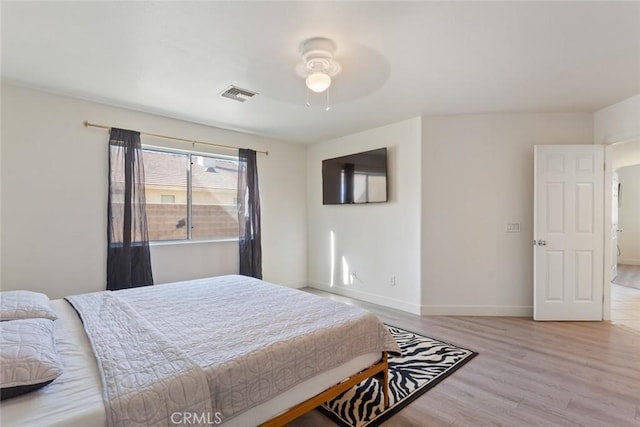 bedroom featuring light hardwood / wood-style floors and ceiling fan