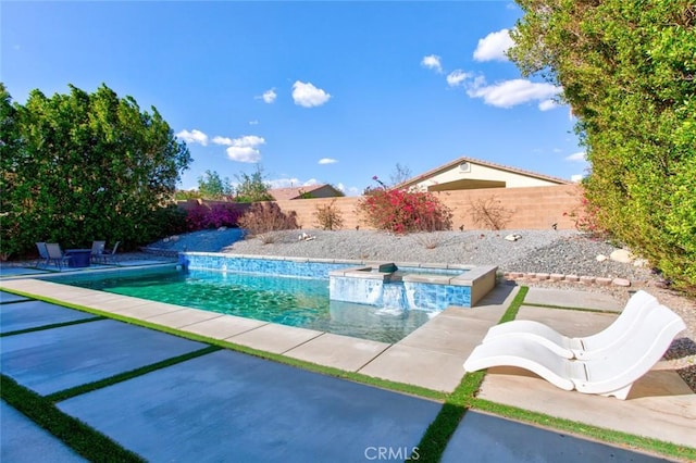 view of pool featuring an in ground hot tub, a patio, and pool water feature