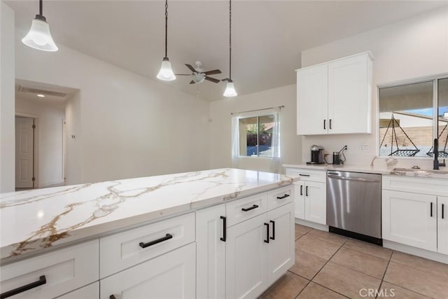 kitchen featuring ceiling fan, dishwasher, pendant lighting, lofted ceiling, and white cabinets