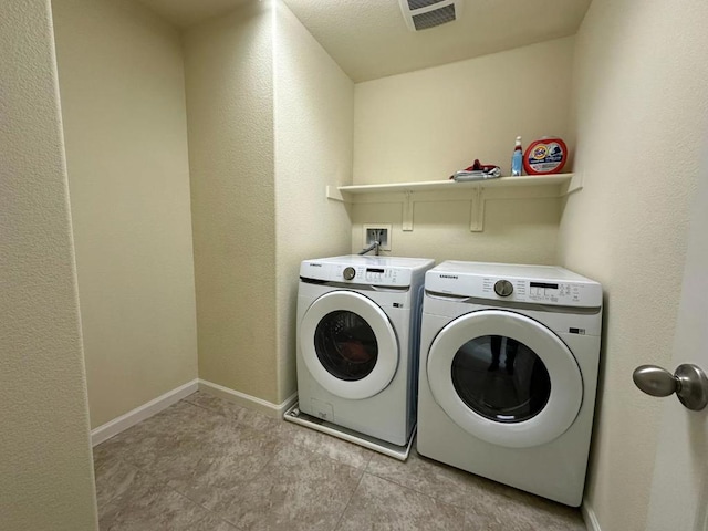 clothes washing area with independent washer and dryer