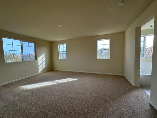 empty room featuring light carpet