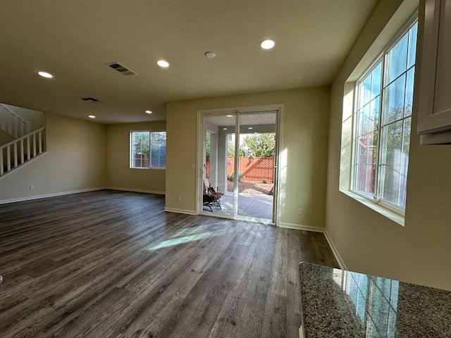 unfurnished room featuring dark hardwood / wood-style floors