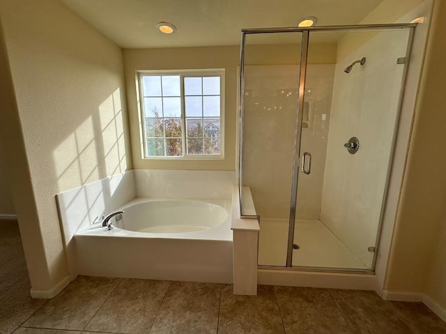 bathroom with tile patterned flooring and plus walk in shower