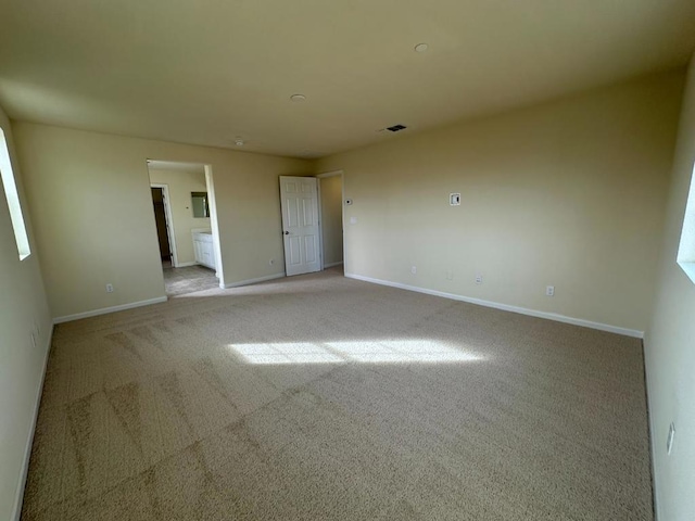 empty room featuring light carpet