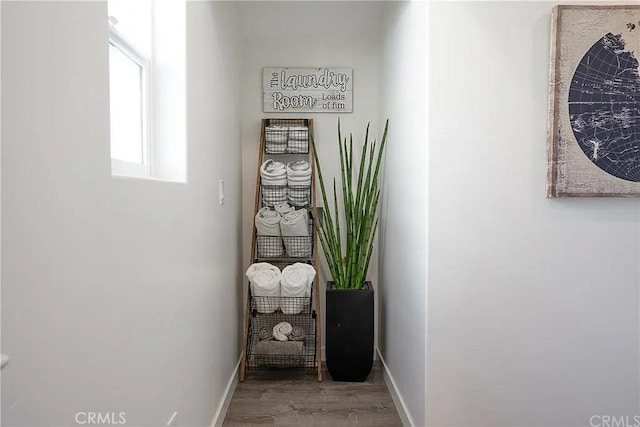 corridor featuring hardwood / wood-style floors