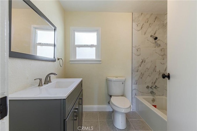 bathroom featuring tile patterned flooring, toilet, shower / bath combination, vanity, and baseboards