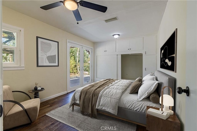 bedroom with french doors, visible vents, dark wood-type flooring, access to outside, and baseboards