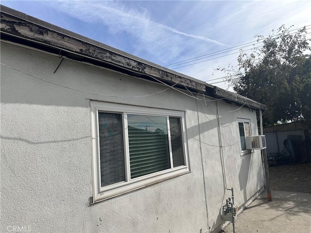 view of side of property featuring cooling unit