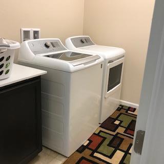 clothes washing area featuring washing machine and clothes dryer