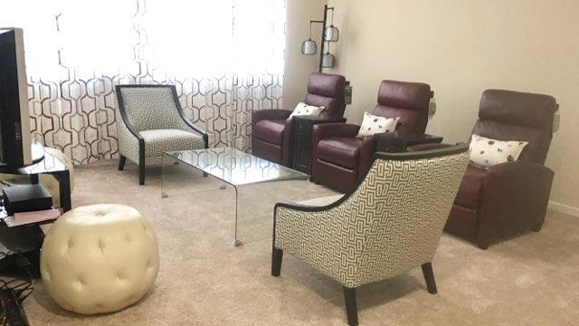 living area with light carpet