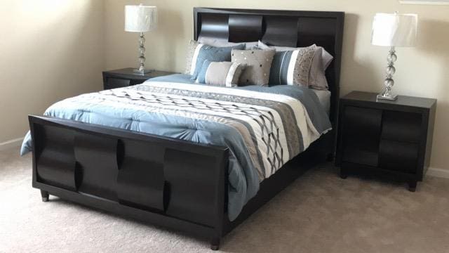 bedroom with light colored carpet