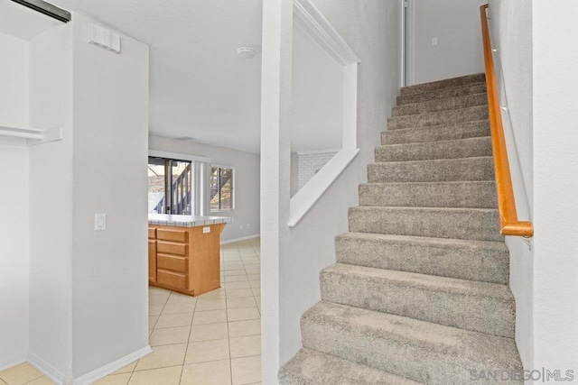 stairs with tile patterned flooring