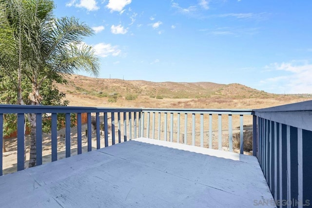 wooden terrace with a mountain view