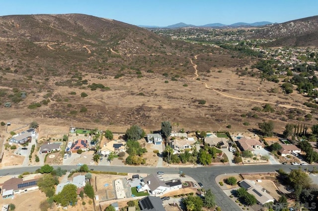 birds eye view of property with a mountain view