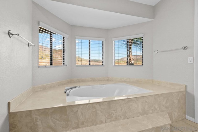 bathroom with tiled tub