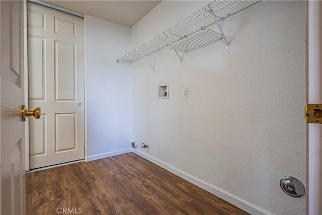 laundry area with gas dryer hookup, dark hardwood / wood-style flooring, and washer hookup