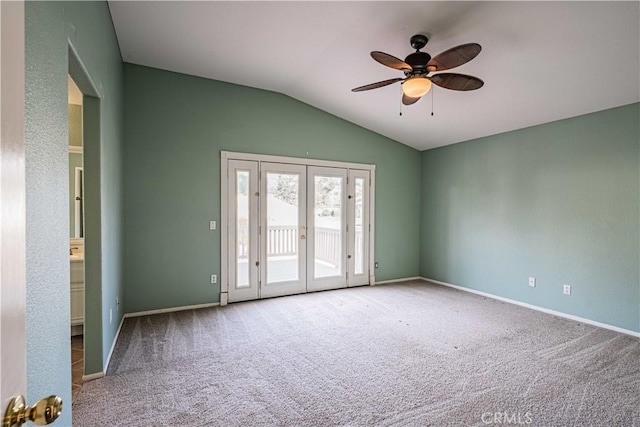 unfurnished room featuring ceiling fan, french doors, lofted ceiling, and carpet