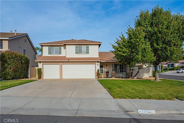 front of property featuring a front lawn and a garage