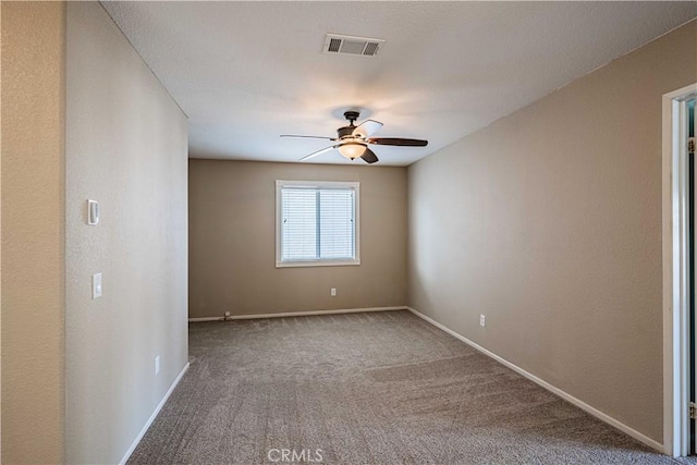 unfurnished room with carpet floors and ceiling fan