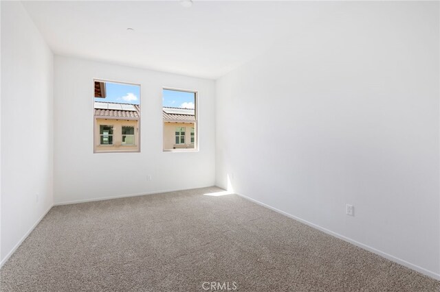 spare room with carpet floors