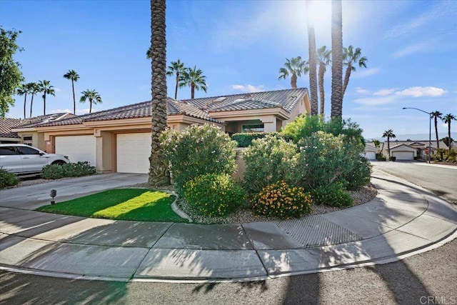 obstructed view of property featuring a garage