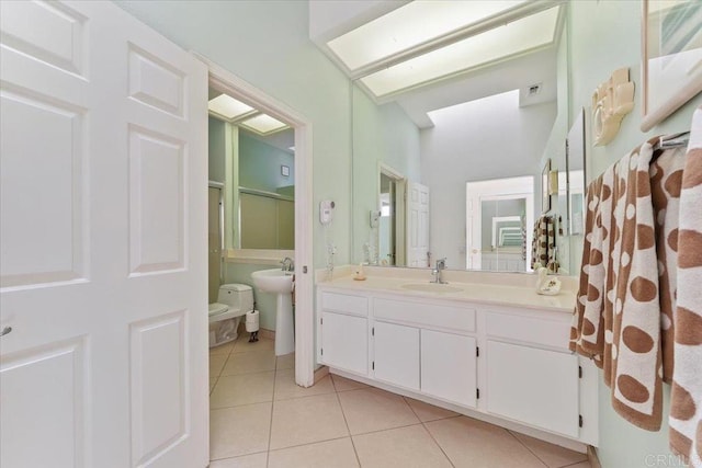 bathroom featuring tile patterned floors, sink, an enclosed shower, and toilet