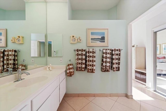 bathroom featuring tile patterned flooring and vanity