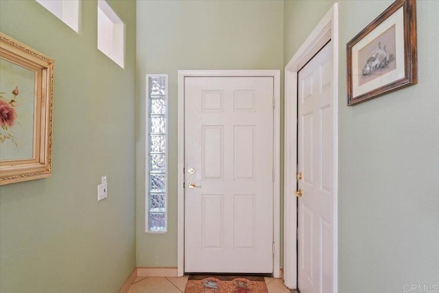 tiled foyer entrance with a wealth of natural light