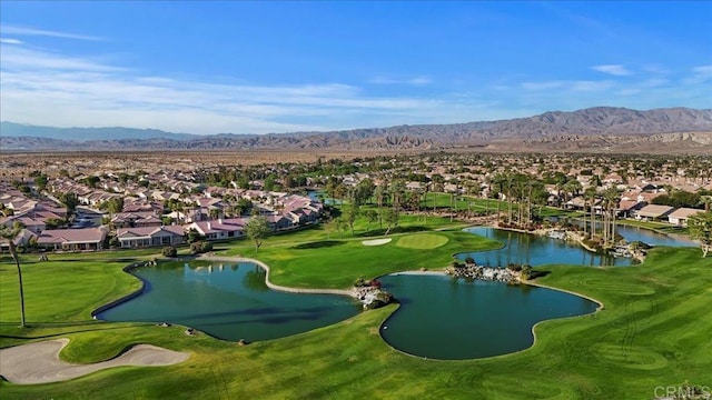 surrounding community with a water and mountain view