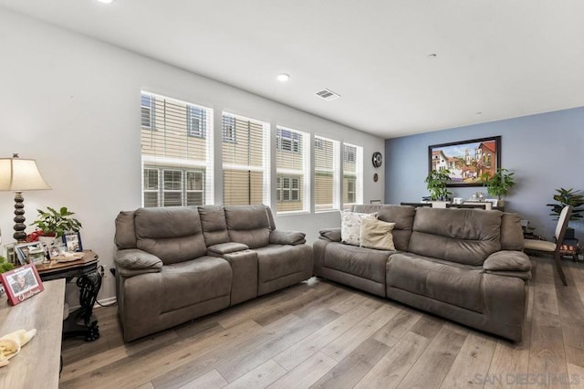 living room with light hardwood / wood-style floors