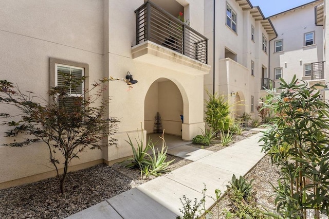 doorway to property featuring a balcony