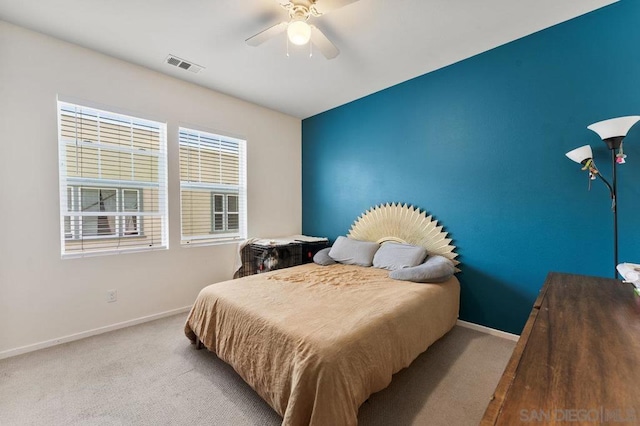 carpeted bedroom with ceiling fan