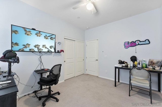 office with light carpet and ceiling fan