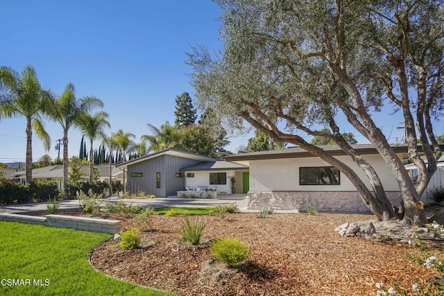 rear view of house featuring a patio area