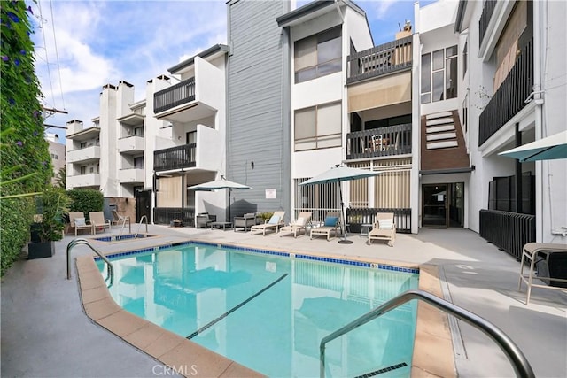 view of pool featuring a patio area