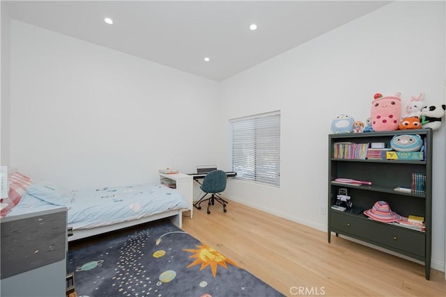 bedroom with hardwood / wood-style floors