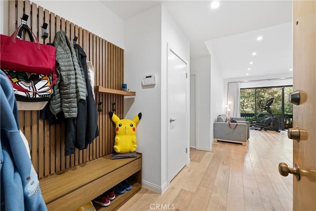 mudroom with light hardwood / wood-style floors