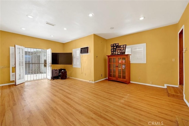 unfurnished living room featuring light wood-type flooring